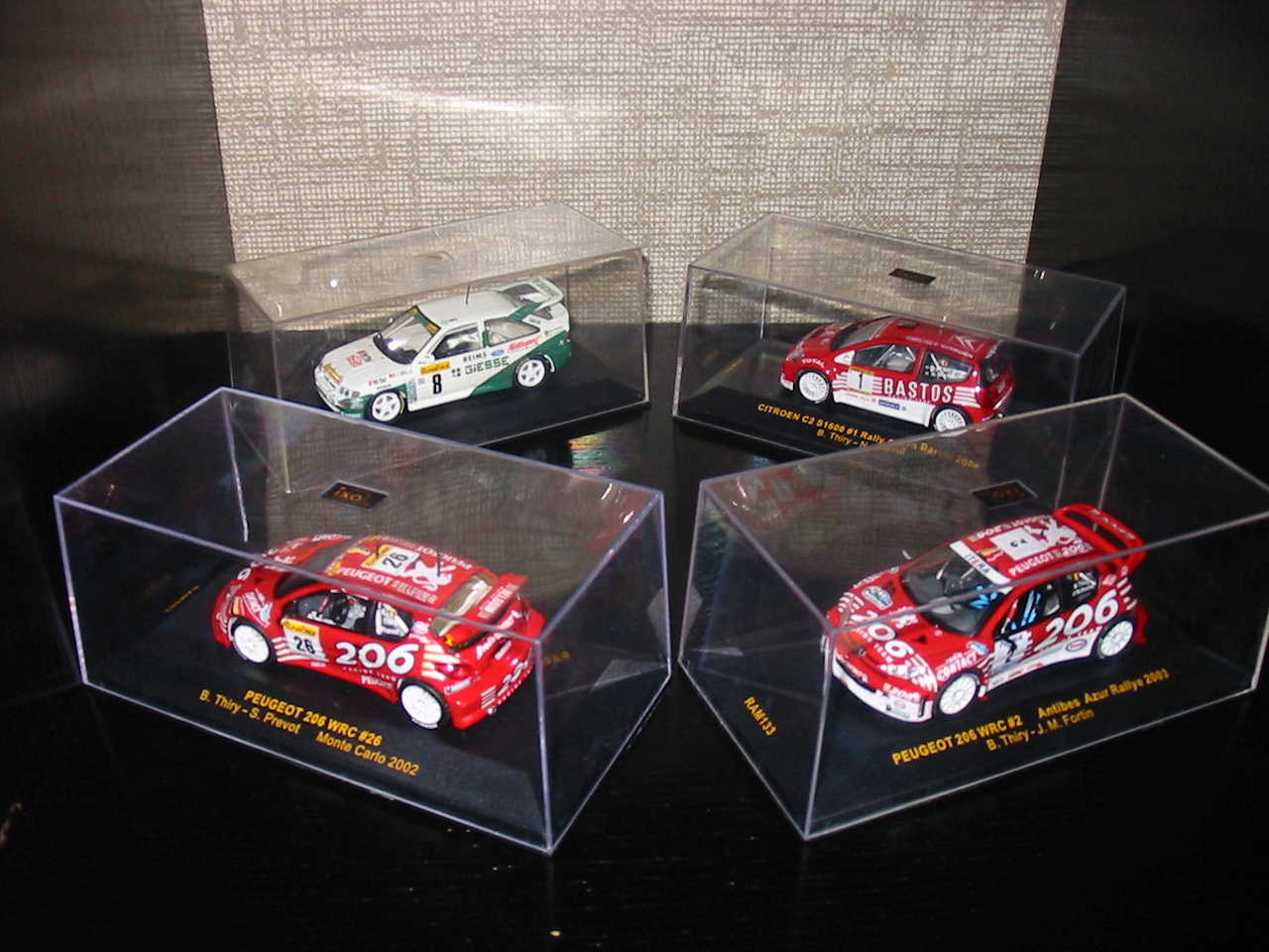 Ford Escort Cosw Minichamps n°8 Monte Carlo 94<br />Citroën C2 S1600 IXO n°1 Barum Rally 2004<br />Peugeot 206 WRC IXO n°26 Monte Carlo 2002<br />Peugeot 206 WRC IXO n°2 Rallye Antibes 2003